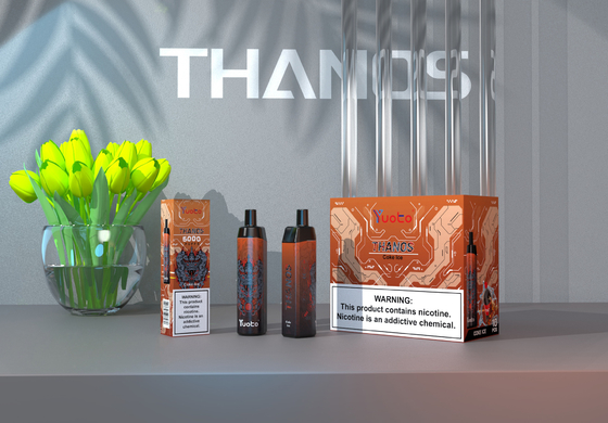 중국 공장에서 5000 분첩 처분할 수 있는 Vape 깍지 복숭아 풍미 Yuoto Thanos 메시 코일 14ml Ejuice 650mAh 건전지